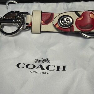Coach Trigger Snap Bag Charm with a cherry print with silver hardware - NWOT